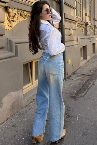 Blugi largi cu talie înaltă și wash vintage în nuanțe calde